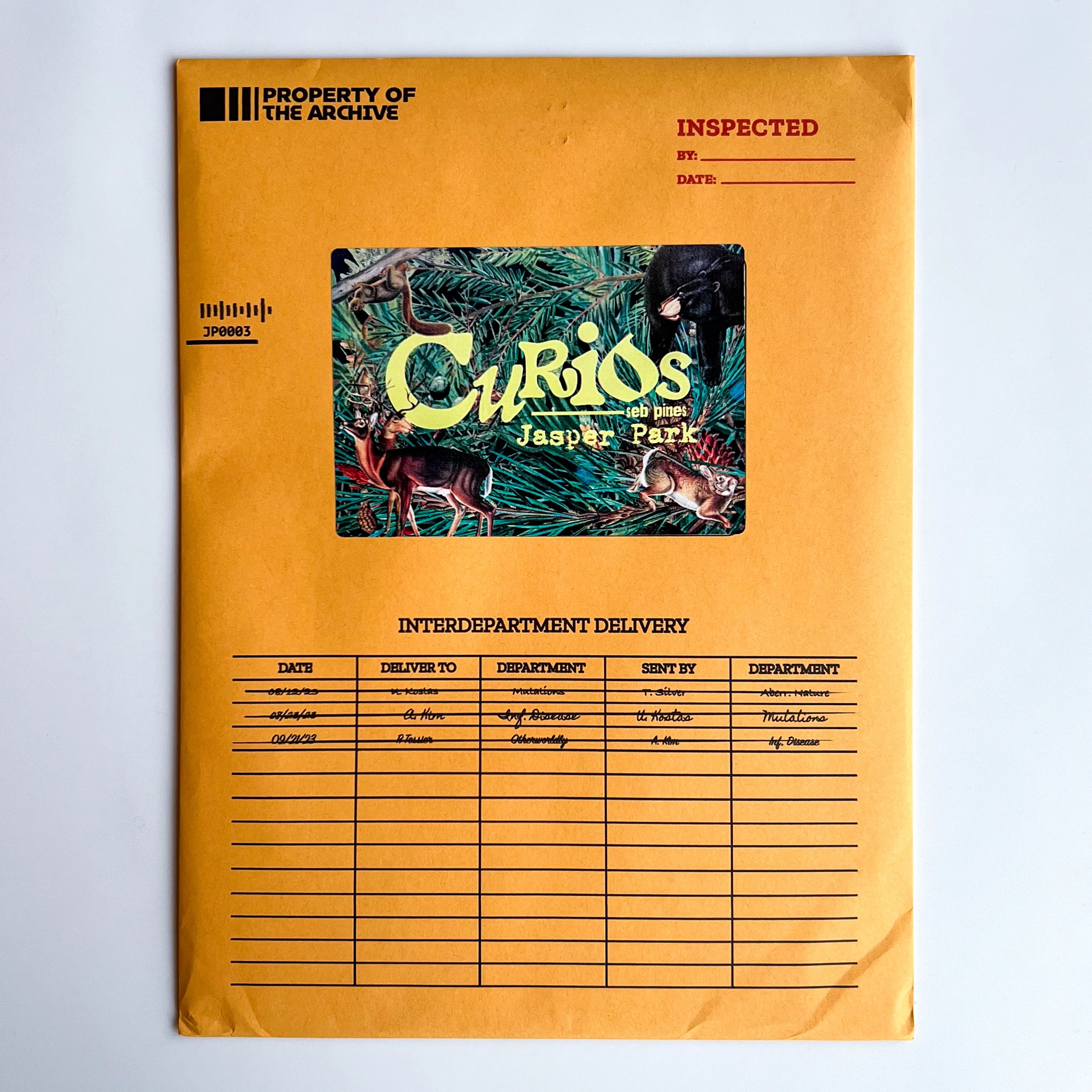Curios: Jasper Park yellow envelope with a postcard partially visible.