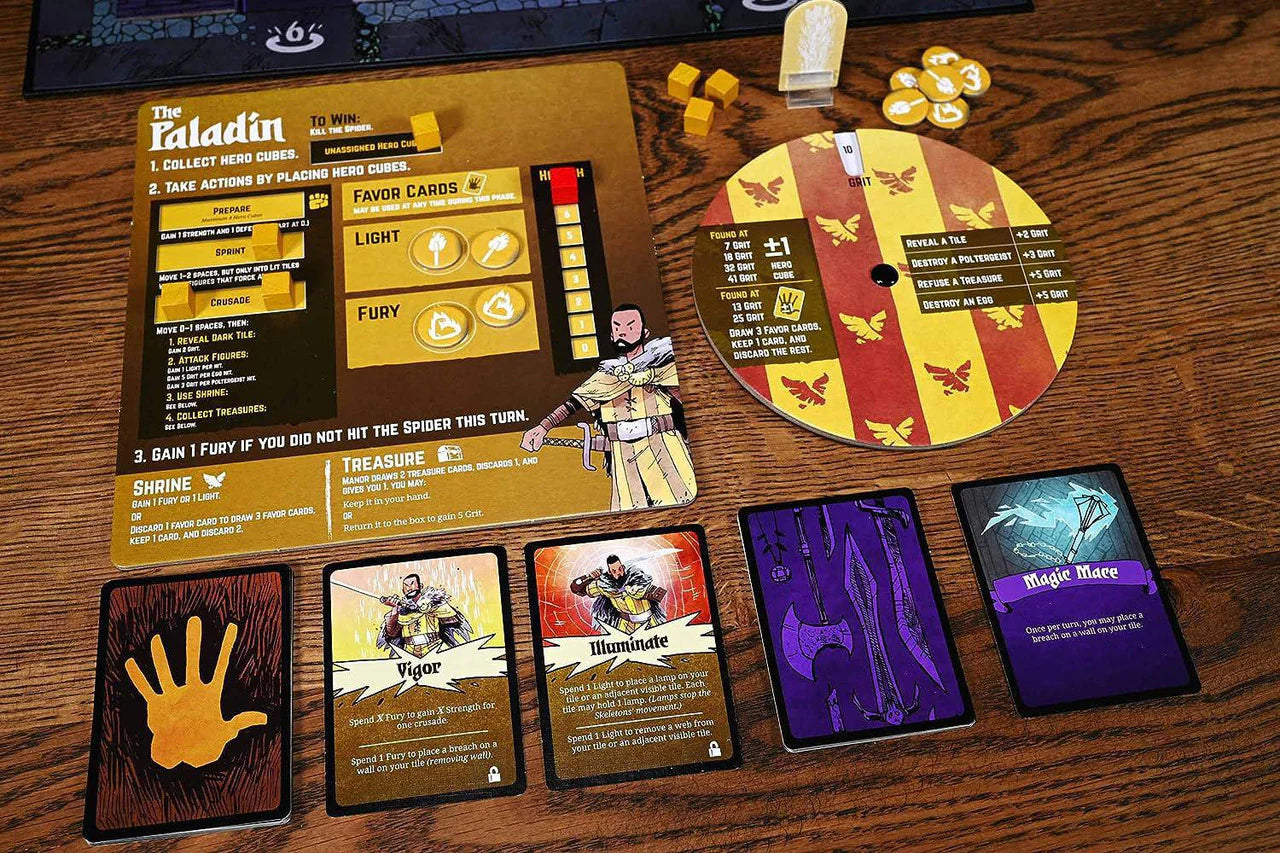 Vast The Mysterious Manor board game with cards, tokens, and stat wheel displayed on a wooden table.