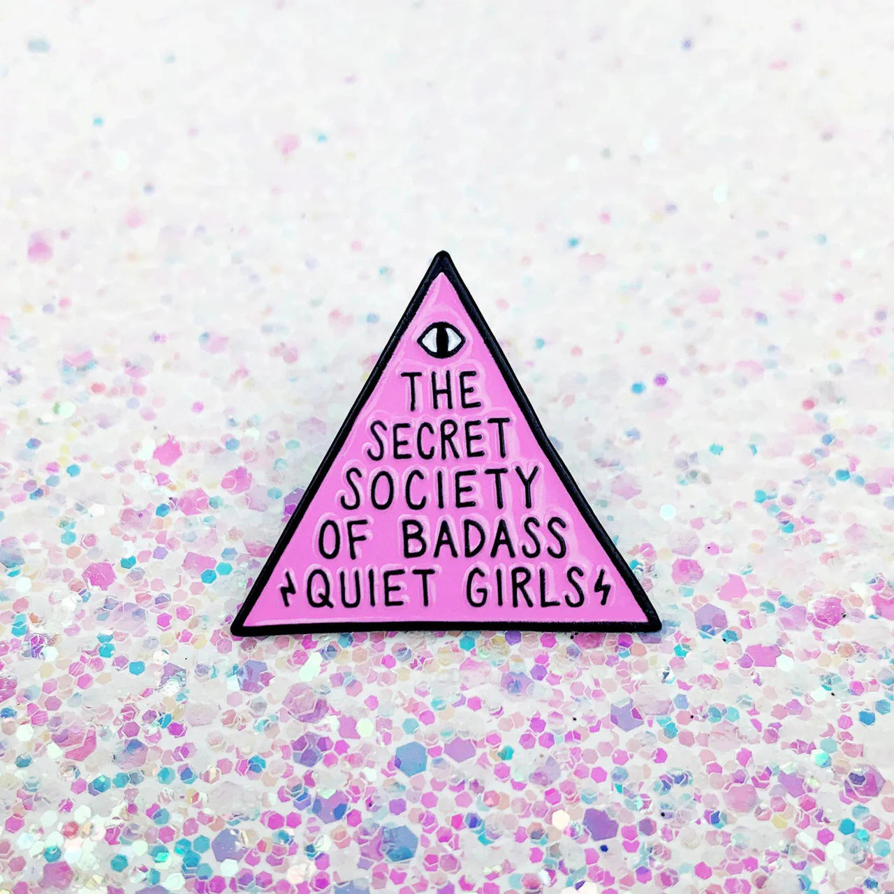 Pink enamel pin with the text The Secret Society of Badass Quiet Girls.