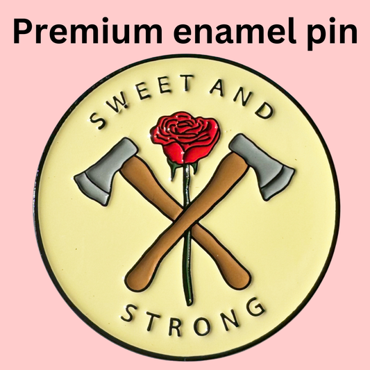 Sweet and Strong Enamel Pin, 1.5 round, featuring crossed axes and red rose design.