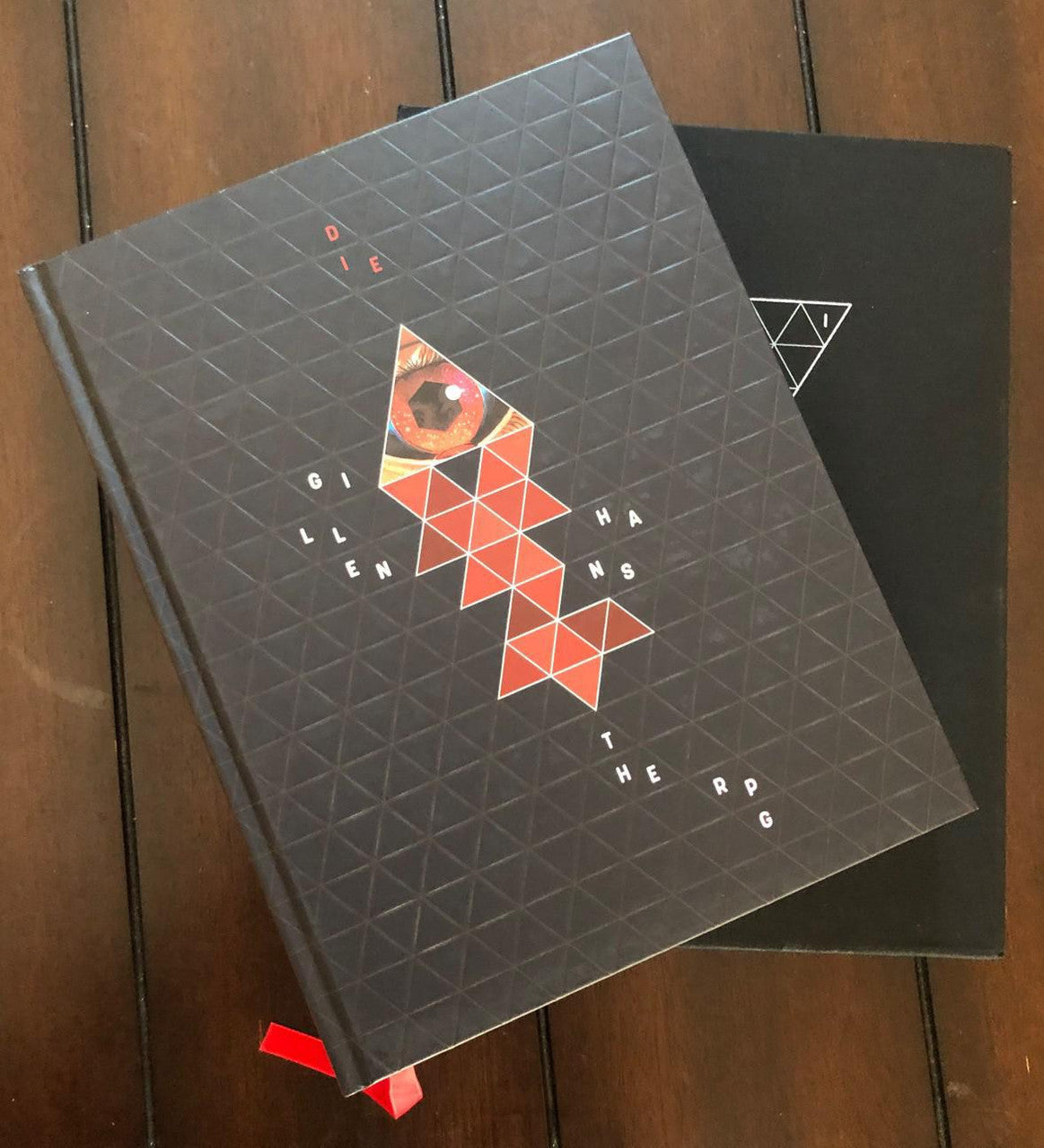 Die: The Role Playing Game (Deluxe) with red geometric patterns.