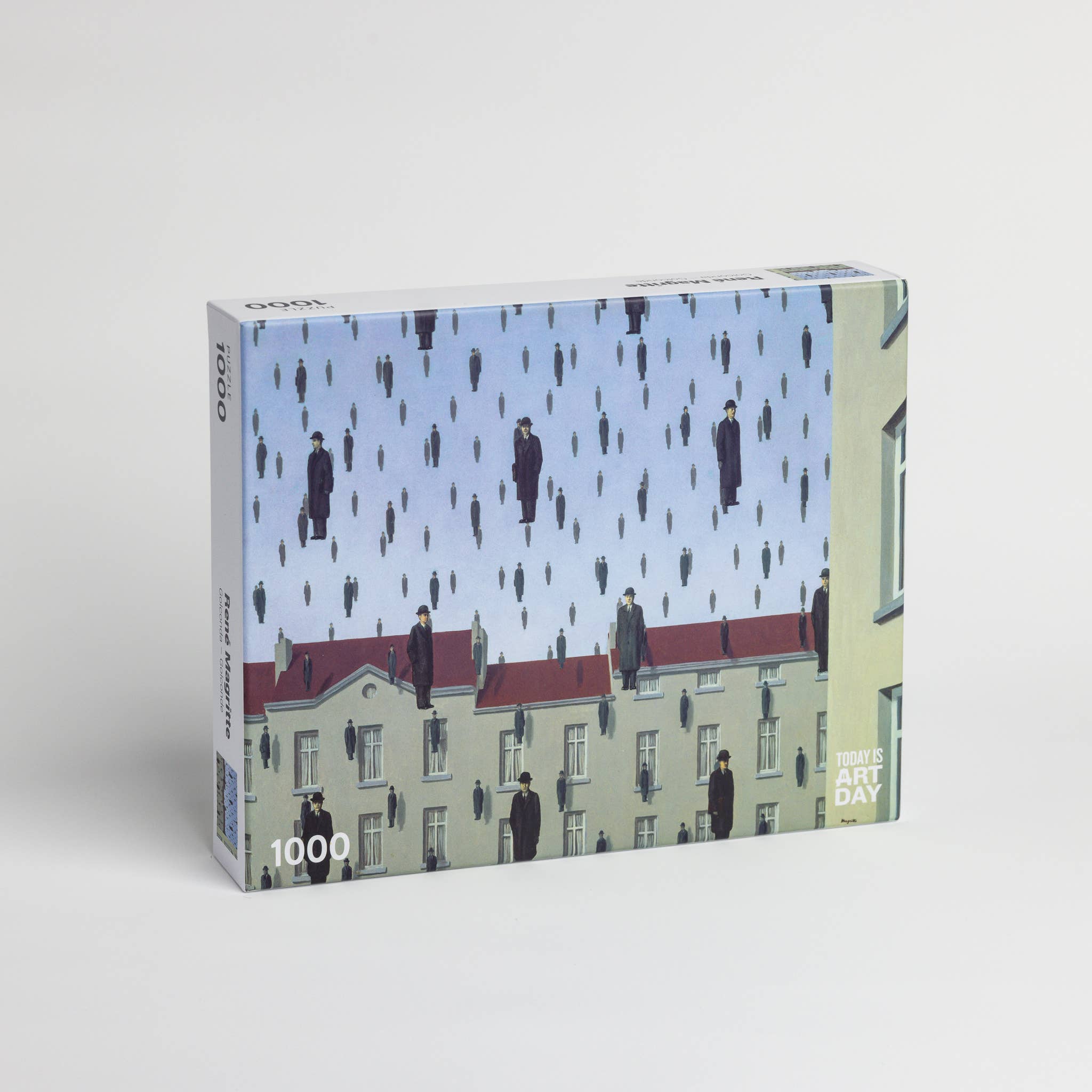 René Magritte Golconda 1000-piece puzzle featuring men in bowler hats raining over rooftops.
