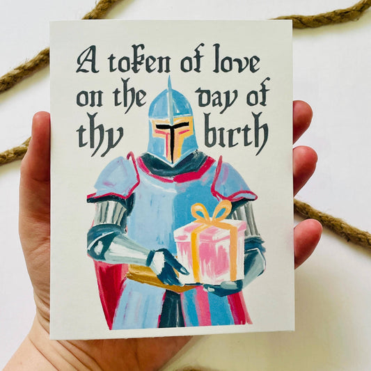 Medieval & Renaissance Role-Playing Birthday Card with knight in armor and birthday token held in a hand.