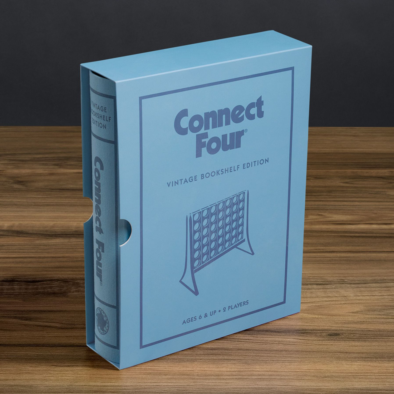 Connect Four Vintage Bookshelf Edition in a blue box, upright on a wooden surface.