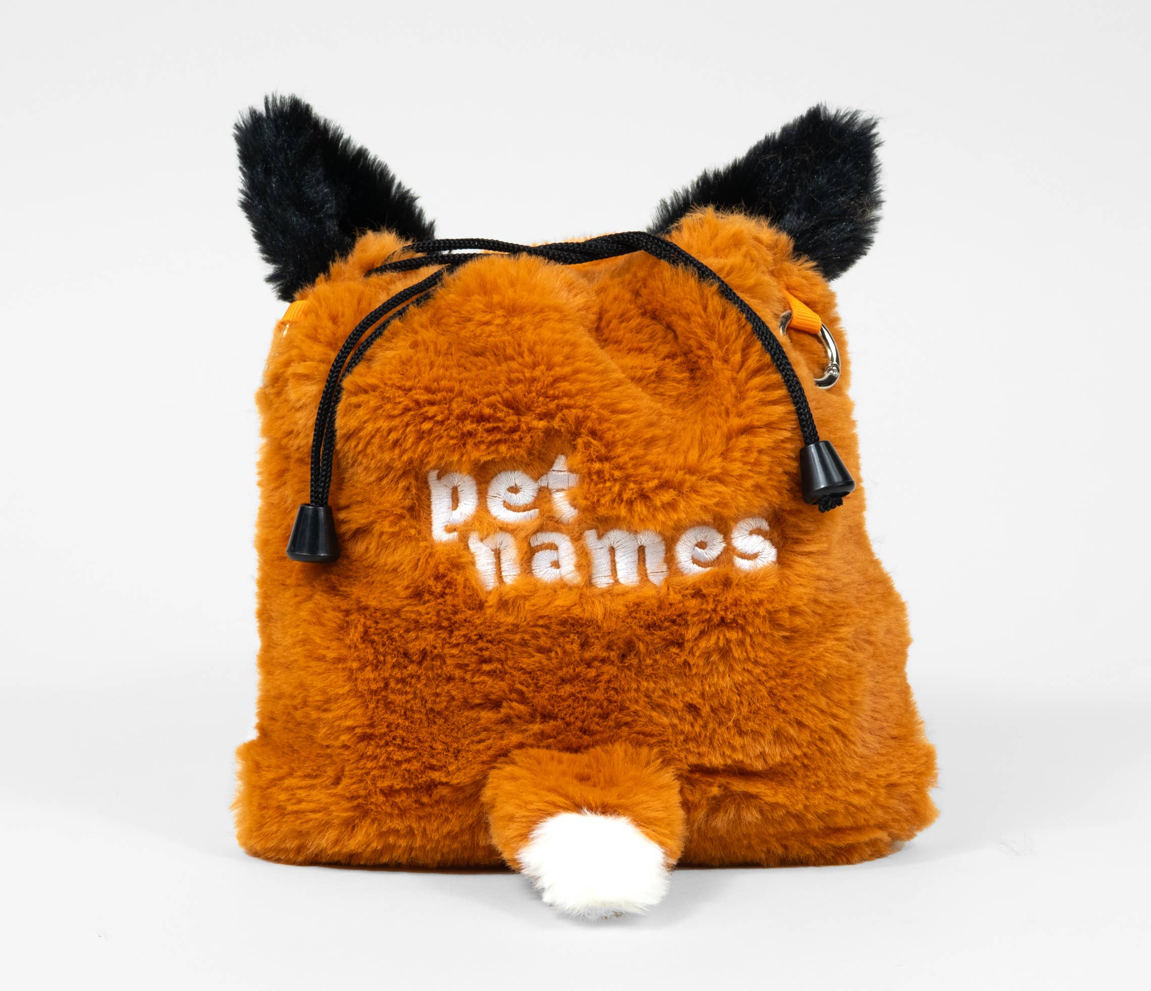 Fuzzy orange fox plush bag embroidered with pet names.