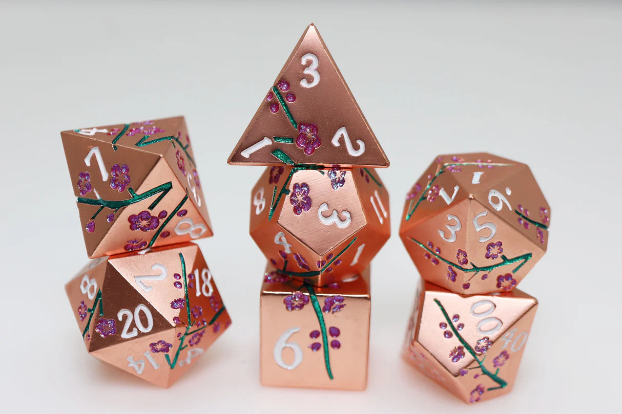 Metallic Bouquet: Copper Cherry Blossoms metal RPG dice set with white numbers on a white surface.