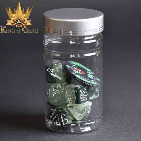 Rogues Rendezvous 11 Dice Set in a clear jar with a ceramic poker chip labeled King of Crits.