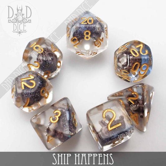 Ship Happens set of 7 clear resin polyhedral dice with sparkly dark purple cores and gold numbers.