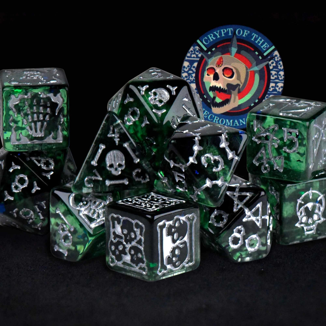 The Crypt of the Necromancer 11 Dice Set with semi-translucent dice, distinct D6s, and a ceramic poker chip.