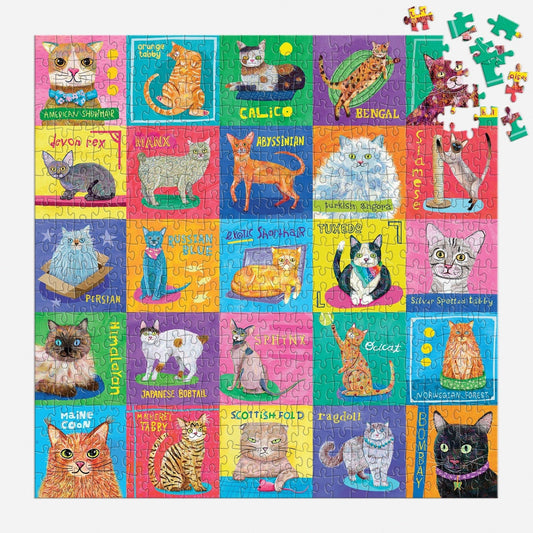 Purr-fect Portraits 500 Piece Family Puzzle with illustrated cats in labeled squares; loose pieces at top right.