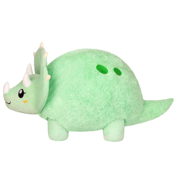 Green plush Triceratops with three horns, short legs, smiling face, and two green spots on its back.