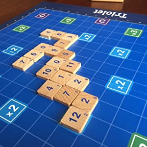 Triolet board game with numbered tiles and blue multiplier squares labeled x2 and C.