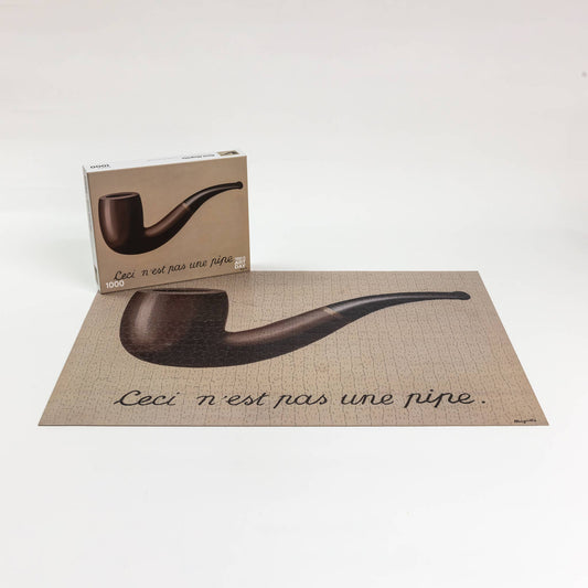 René Magritte This is not a pipe surrealist art puzzle with box shown.