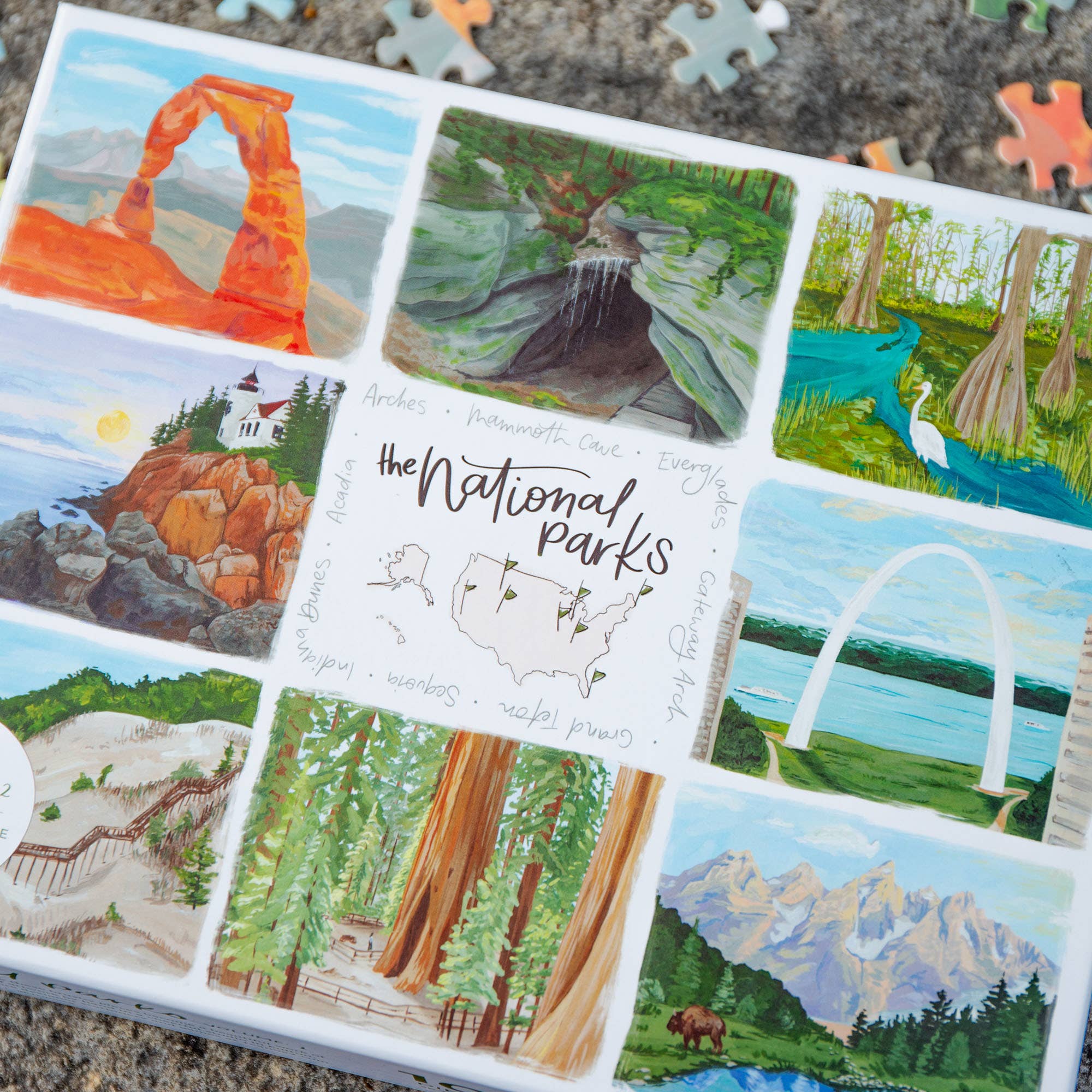 The National Parks 1,000 Piece Jigsaw Puzzle with colorful illustrations of U.S. parks.