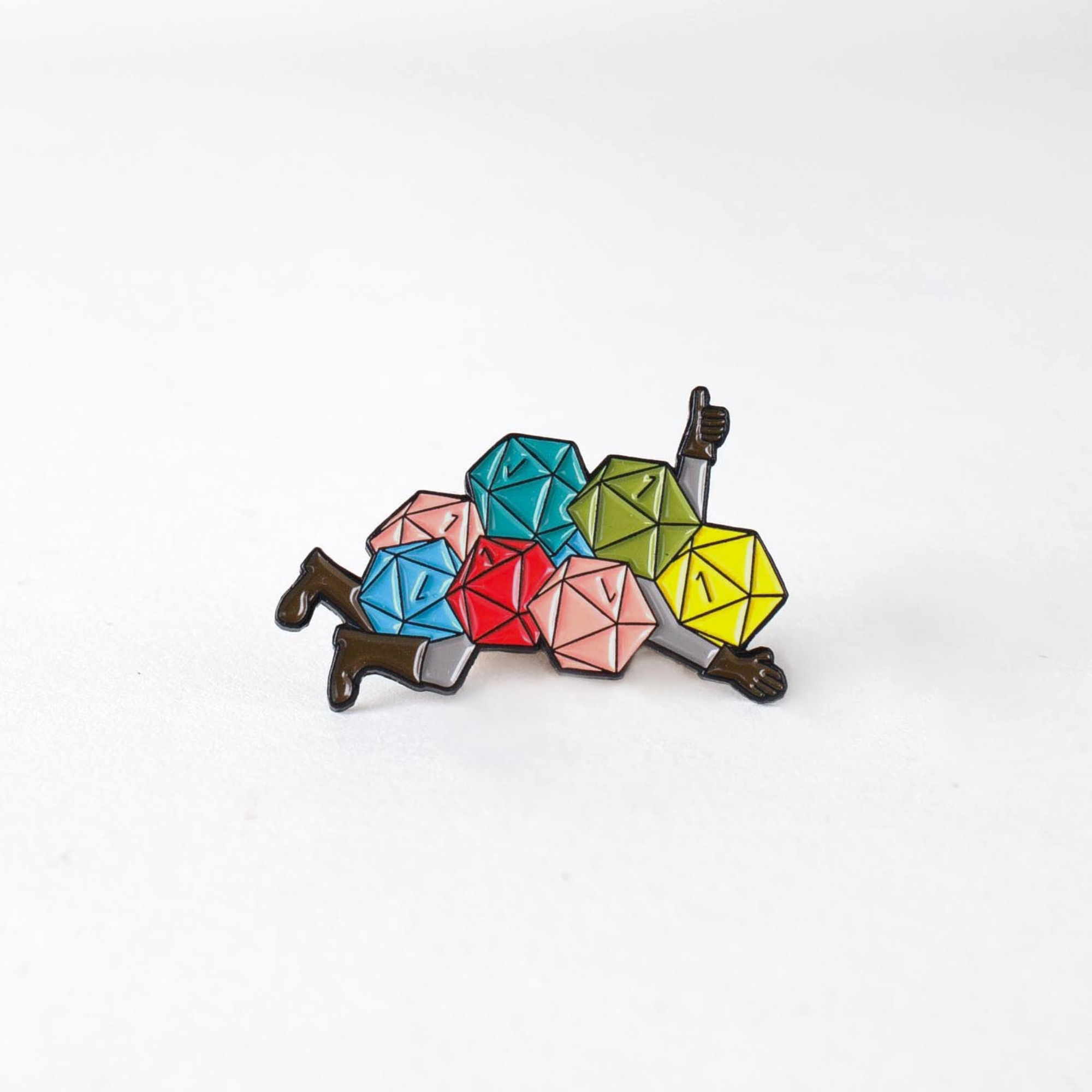 Nat 1 Avalanche Enamel Pin featuring colorful dice forming a person lying down with a thumbs up on a white background.