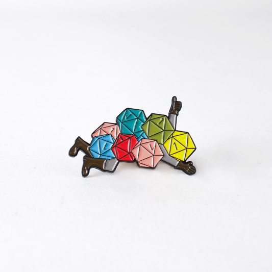 Nat 1 Avalanche Enamel Pin featuring colorful dice forming a person lying down with a thumbs up on a white background.