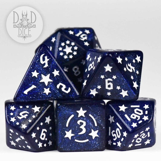 Dark blue glittery resin polyhedral dice with white stars and numbers.