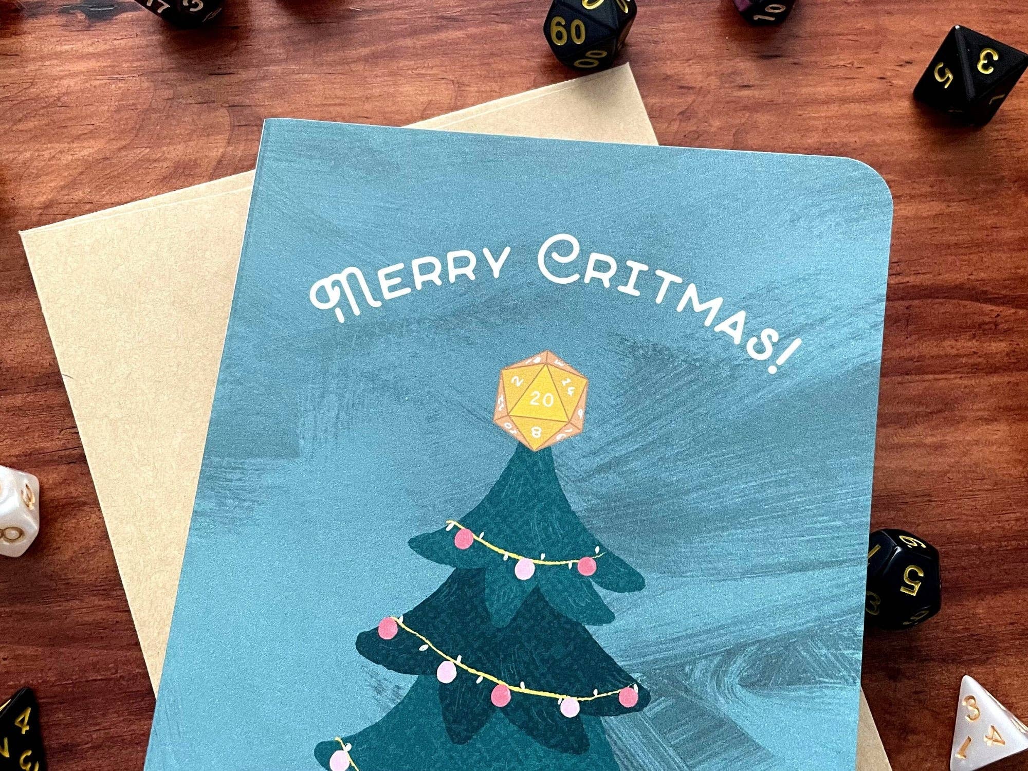 Merry Critmas Holiday Card handmade with gamer dice, text Merry Critmas and tree topped with a DnD die.