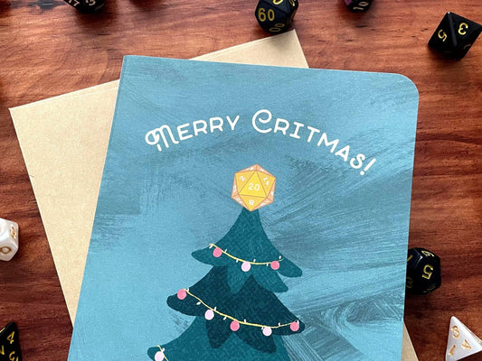 Merry Critmas Holiday Card handmade with gamer dice, text Merry Critmas and tree topped with a DnD die.