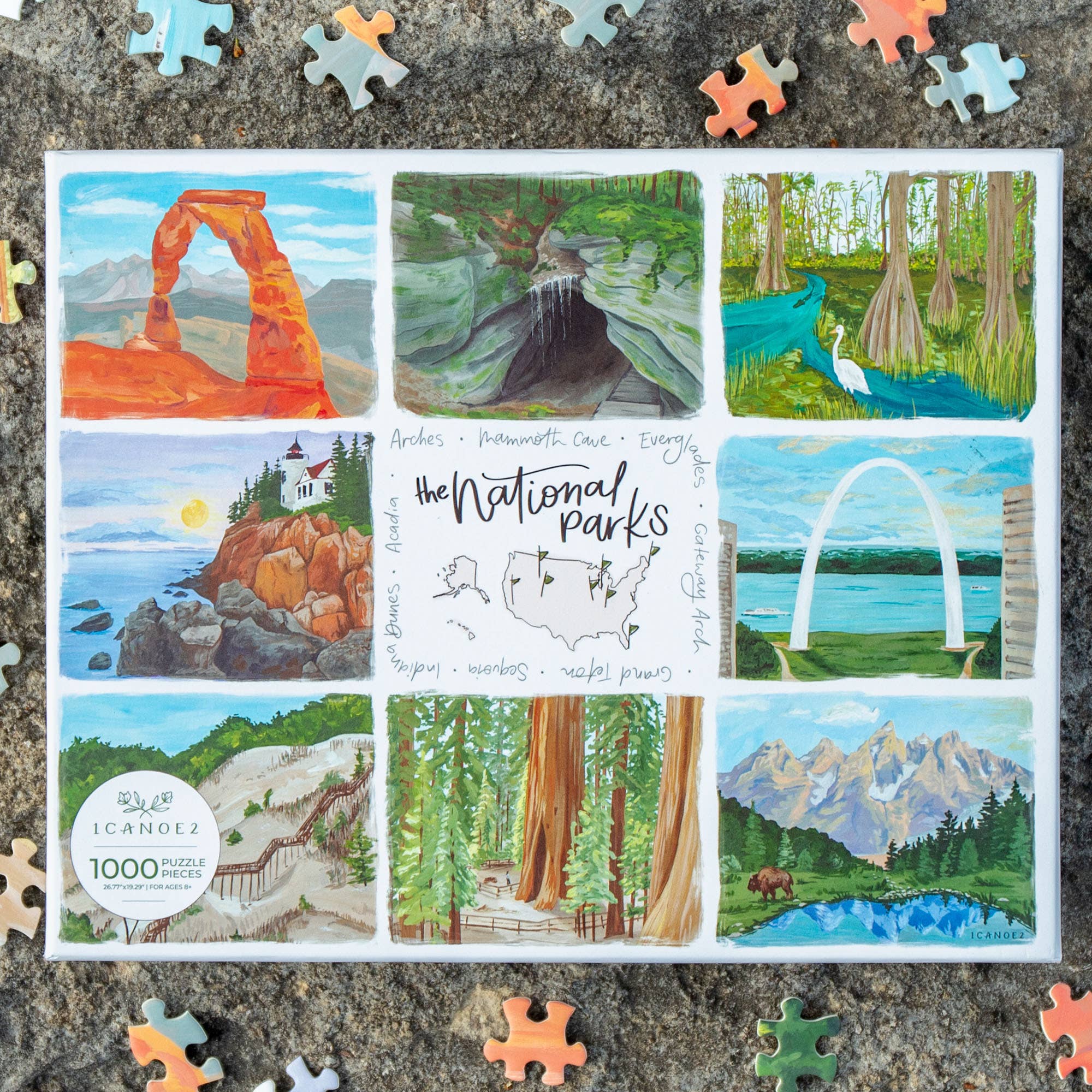 The National Parks 1,000 Piece Jigsaw Puzzle with illustrations of U.S. national parks and several loose pieces shown.