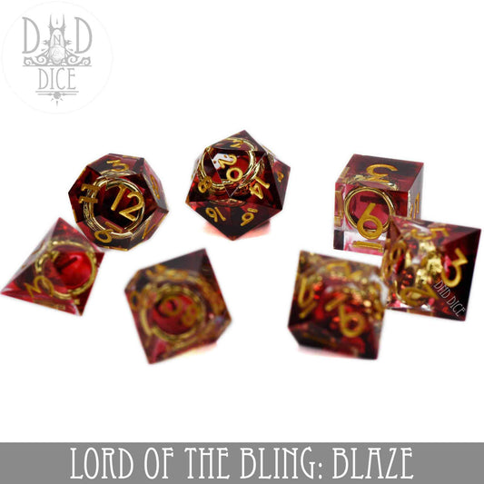 Lord of the Bling: Blaze, handmade 7-piece red and gold resin DND dice set with gold rings inside.