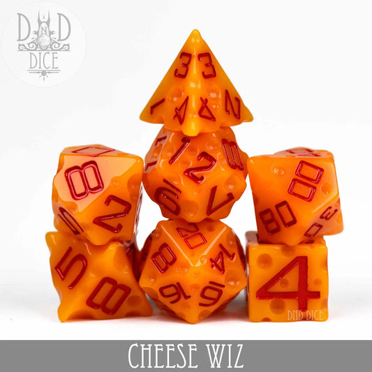 Cheese Wiz Dice: orange polyhedral dice with red numbers and cheese-like design, labeled CHEESE WIZ.