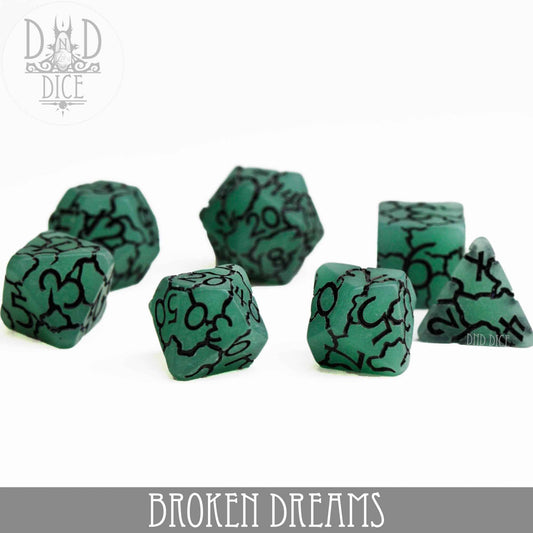 Set of 7 green resin dice with black cracks and numbers for tabletop gaming.