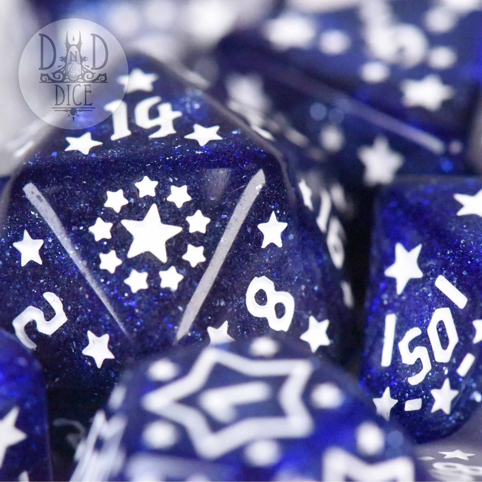 Star Spangled blue resin polyhedral dice with white stars and visible numbers 14, 8, 2, and 150.