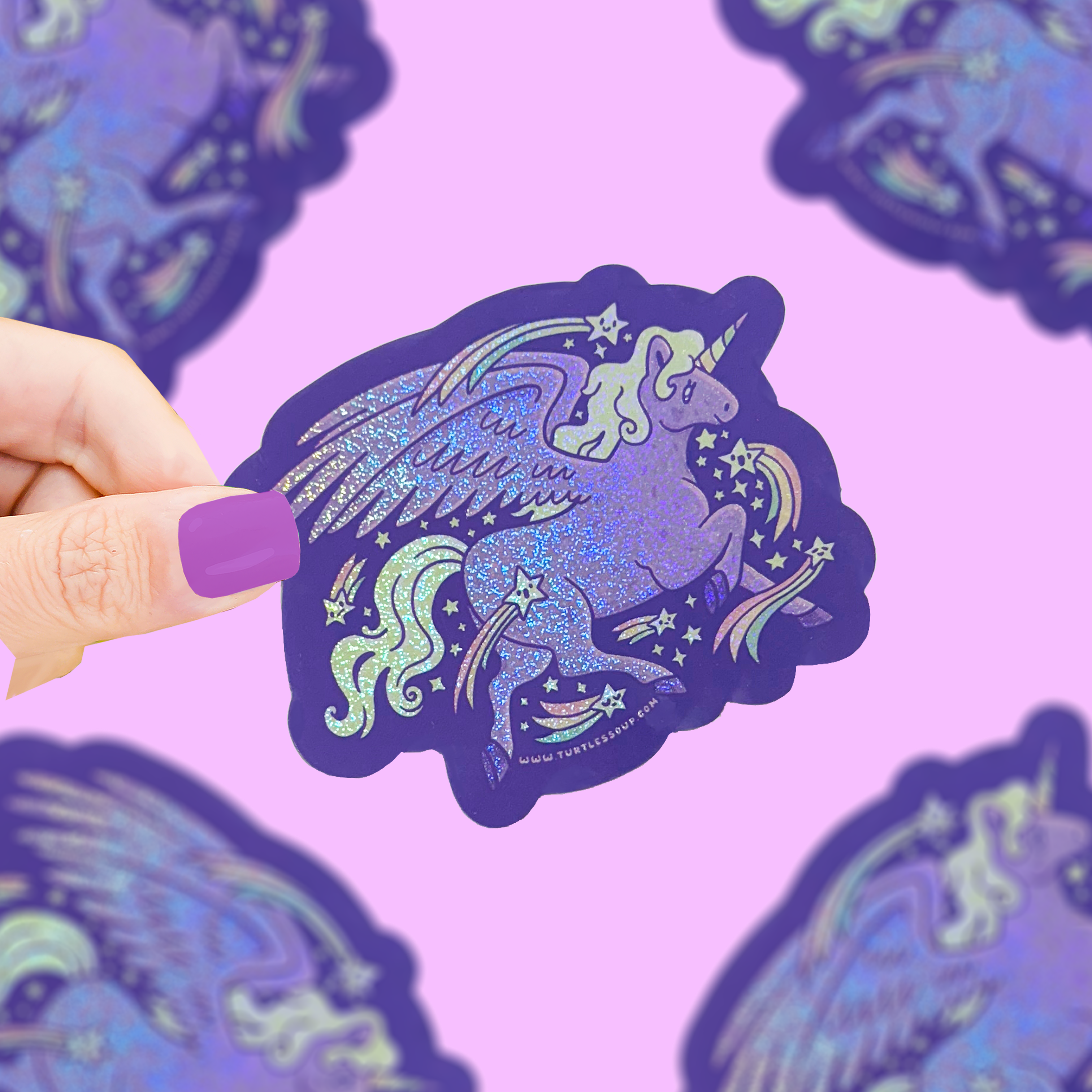 Glittery Unicorn Whimsical Shiny Sticker held by a hand with purple nails.