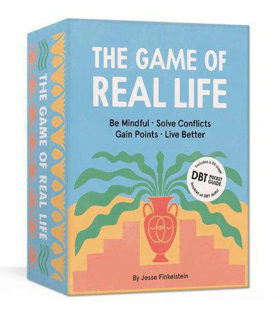 Blue box of The Game of Real Life – Be Mindful. Solve Conflicts. Gain Points. Live Better. mindfulness card game.