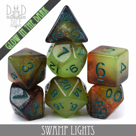 Swamp Lights Glow in the Dark dice set, green and brown with blue numbers.