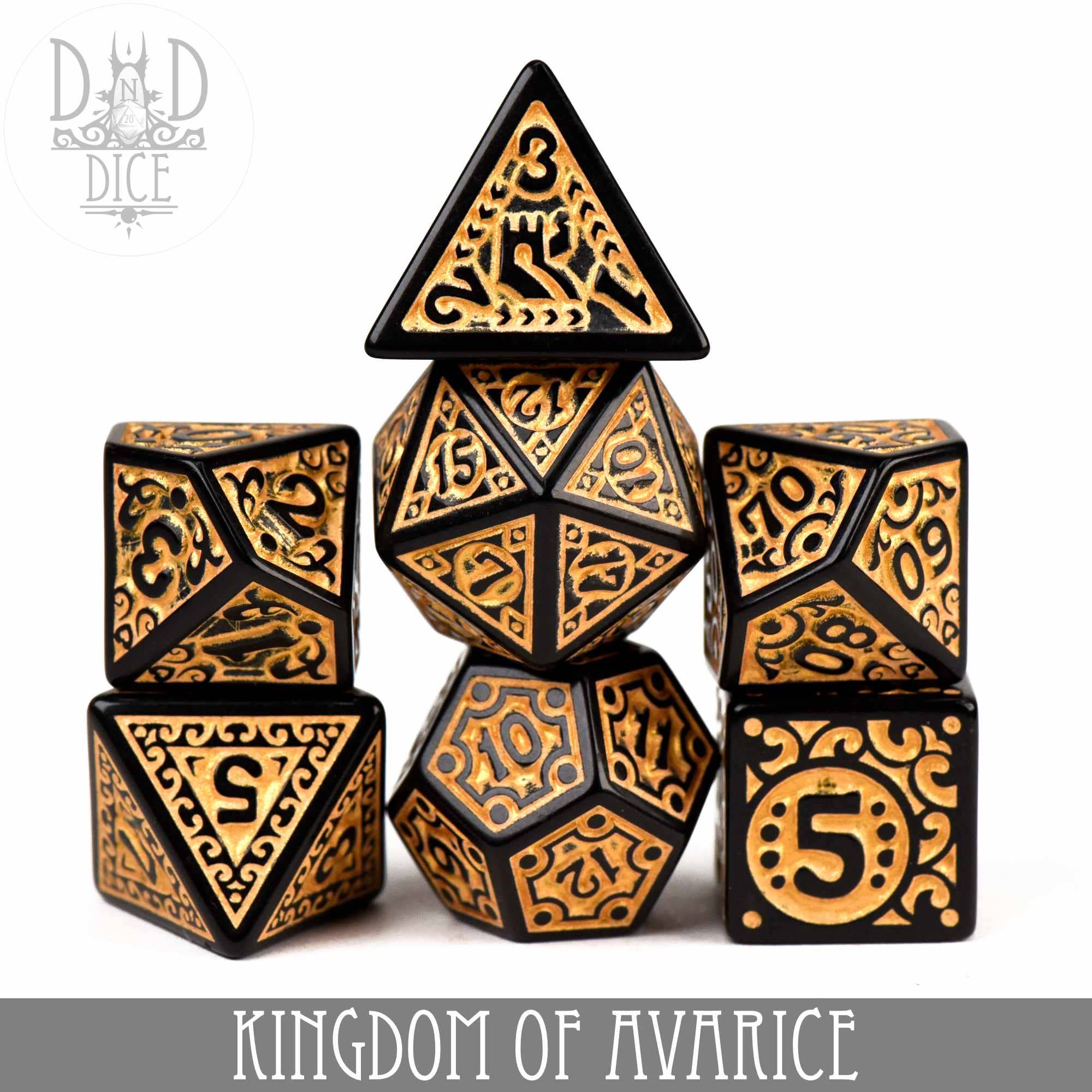Kingdom of Avarice 7-piece black and gold ornate acrylic dice set for tabletop gaming.