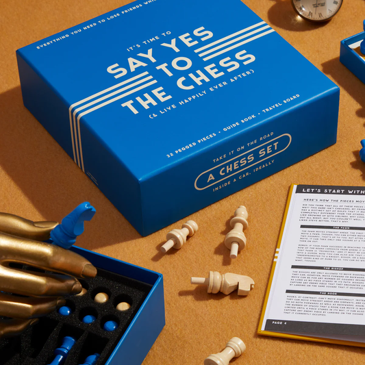 It’s Time to Say Yes to Chess Travel Edition with blue box, pegged pieces, gold hand knight, and open instructions.