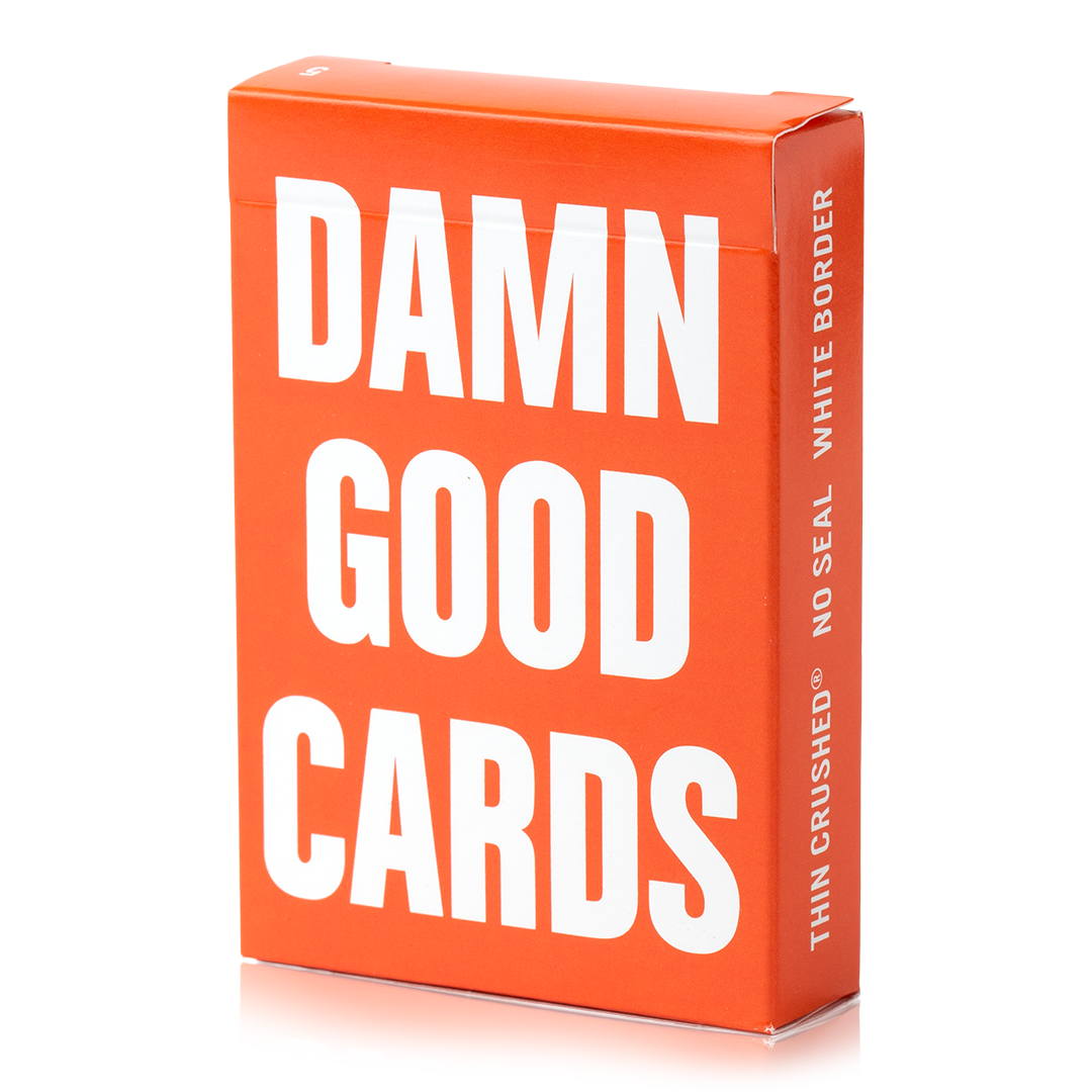 Orange Damn Good Cards, No. 5 poker-size playing cards with white text.