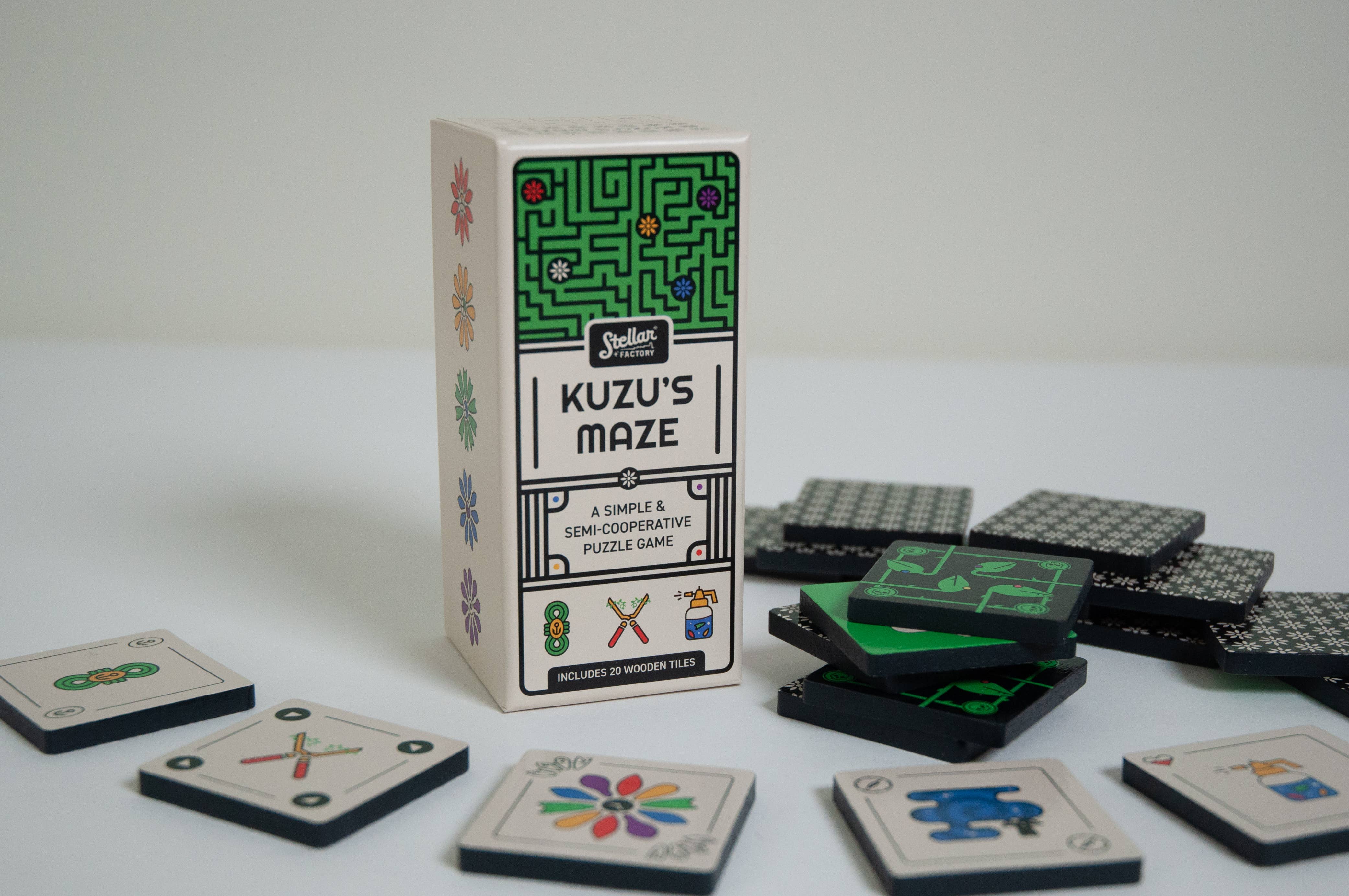 Kuzus Maze board game with game tiles displaying assorted symbols and patterns.