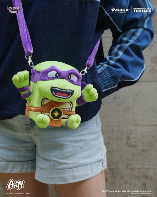MTG ARTY Deck Box - Donatello with detachable strap, held by person in denim shorts and blue jacket.