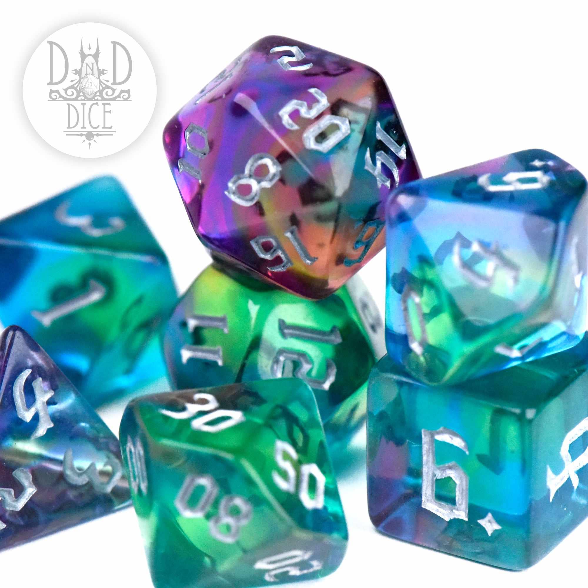 Acrylic 7-dice set, white numbers on blue, green, and purple with a white base; Alluring Aurora variant.