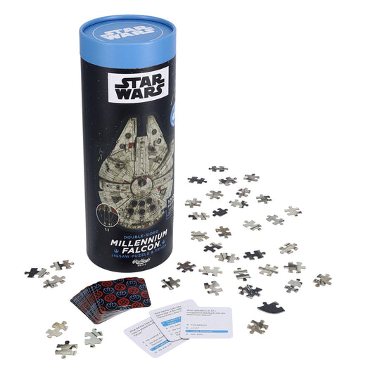 Star Wars Millennium Falcon Jigsaw Puzzle and Trivia set with loose puzzle pieces, trivia cards, and a cylindrical box.