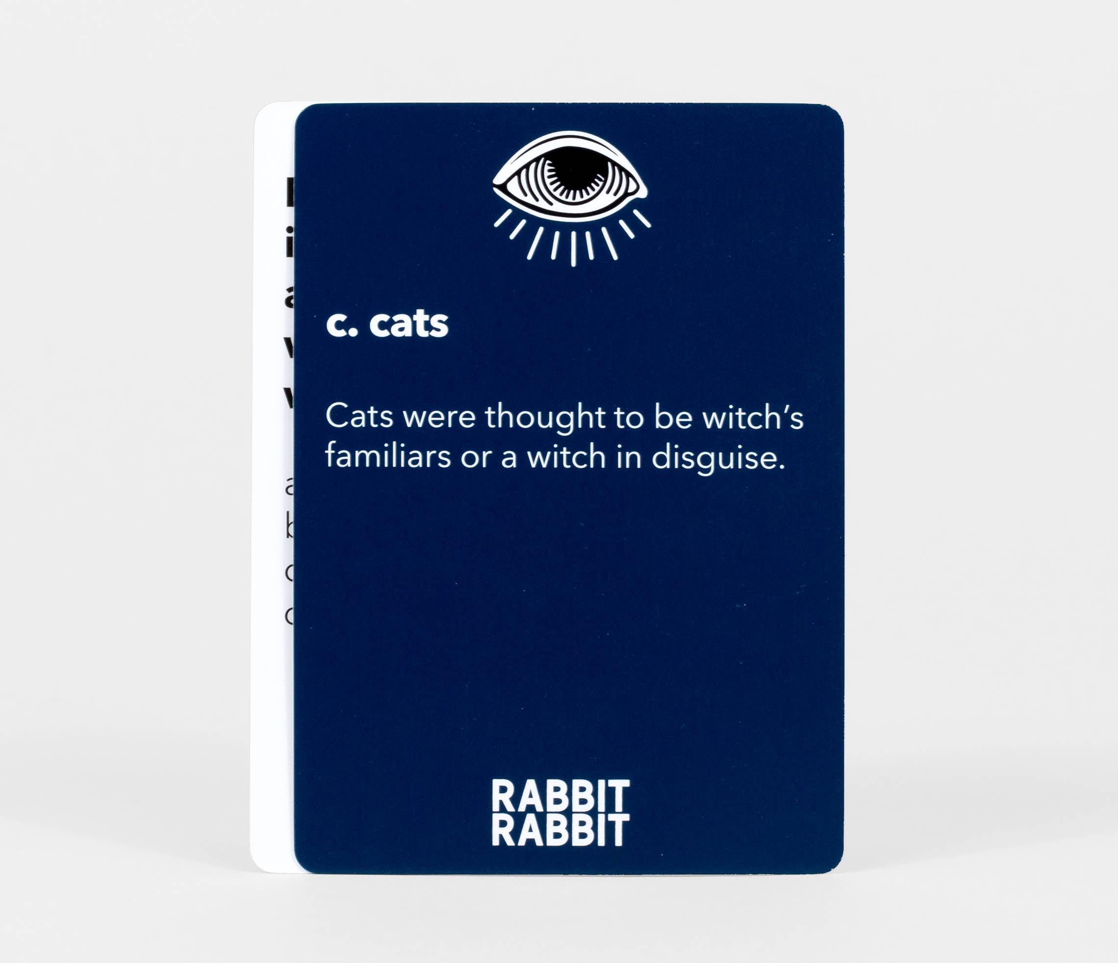 Rabbit Rabbit: A Game of Superstitions dark blue card printed with c. cats—once believed to be witches familiars.