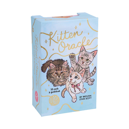 Kitten Oracle deck in pastel box with gold accents and three illustrated kittens on oracle cards.