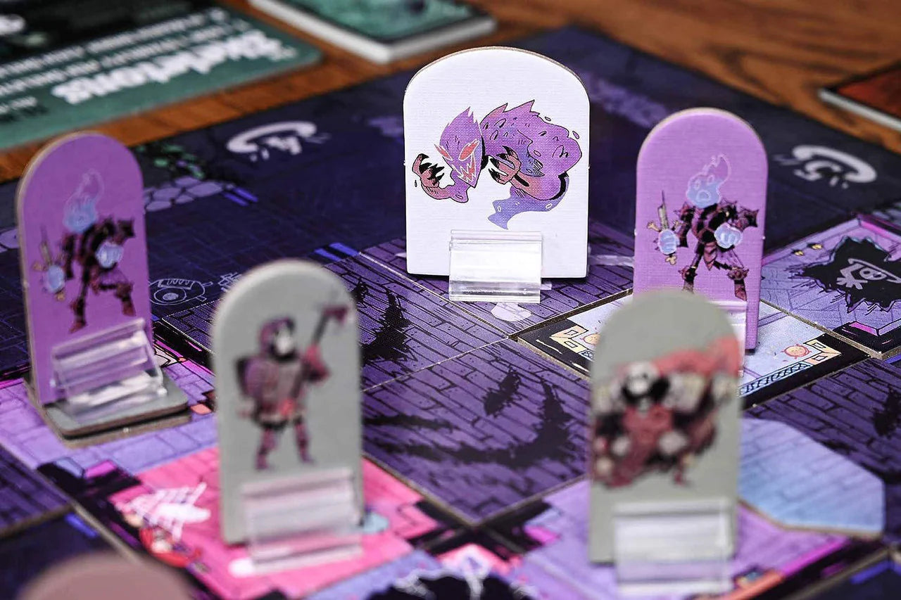 Colorful standees and illustrated characters on an asymmetrical game board for Vast The Mysterious Manor.