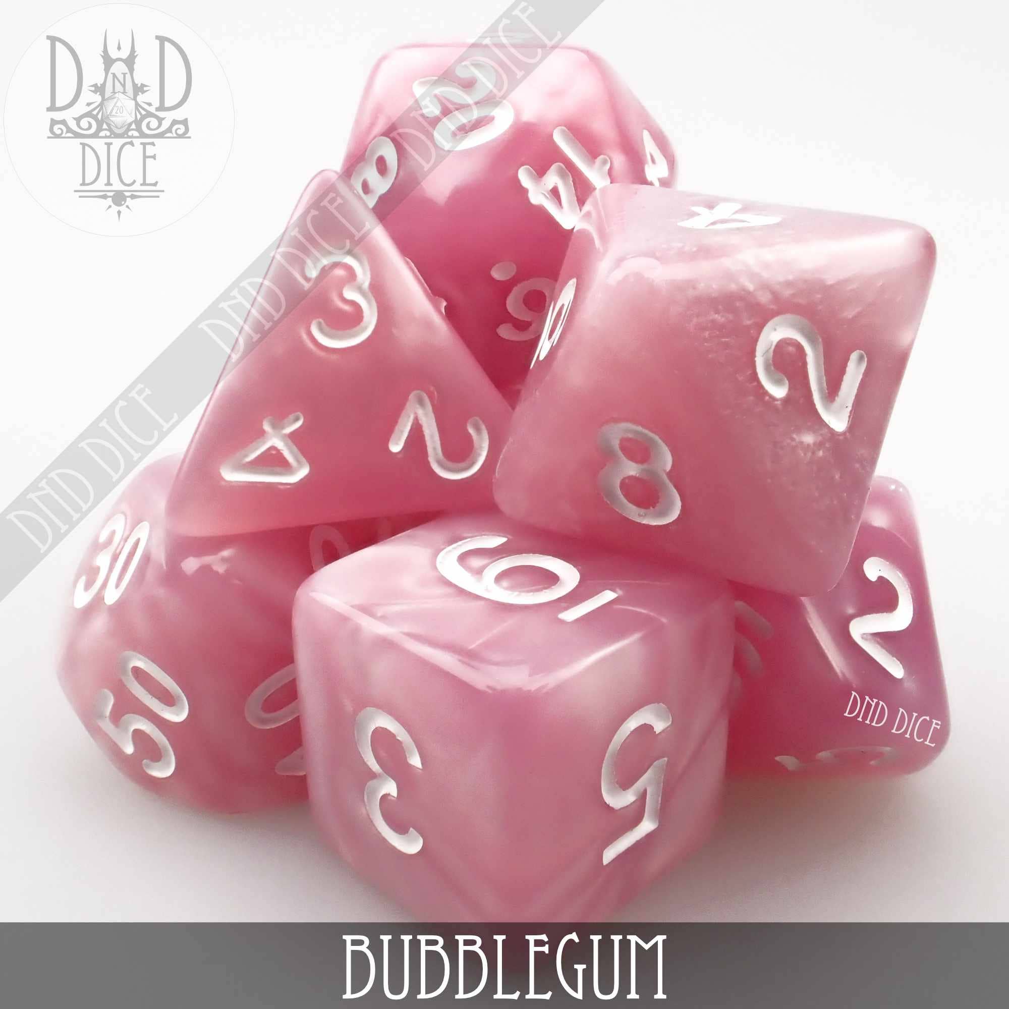 Bubblegum shiny pink acrylic 7-dice set with white numbers.