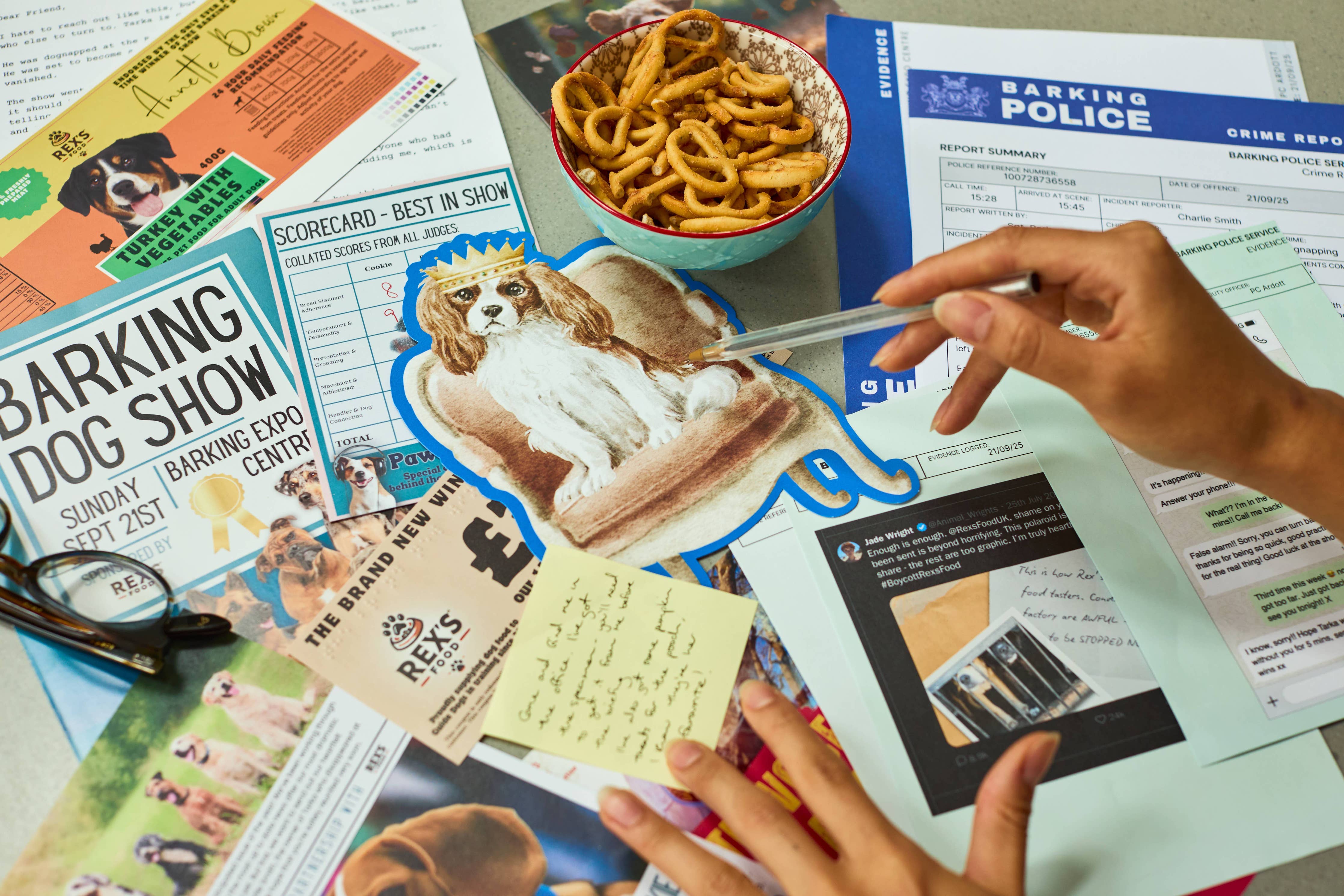 Hands interact with “Cold Case: Who Let The Dogs Out?” game surrounded by clues, snacks, and notes on a table.