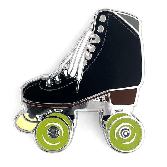 Black roller skate pin with glow-in-the-dark wheels and white laces on a white background.