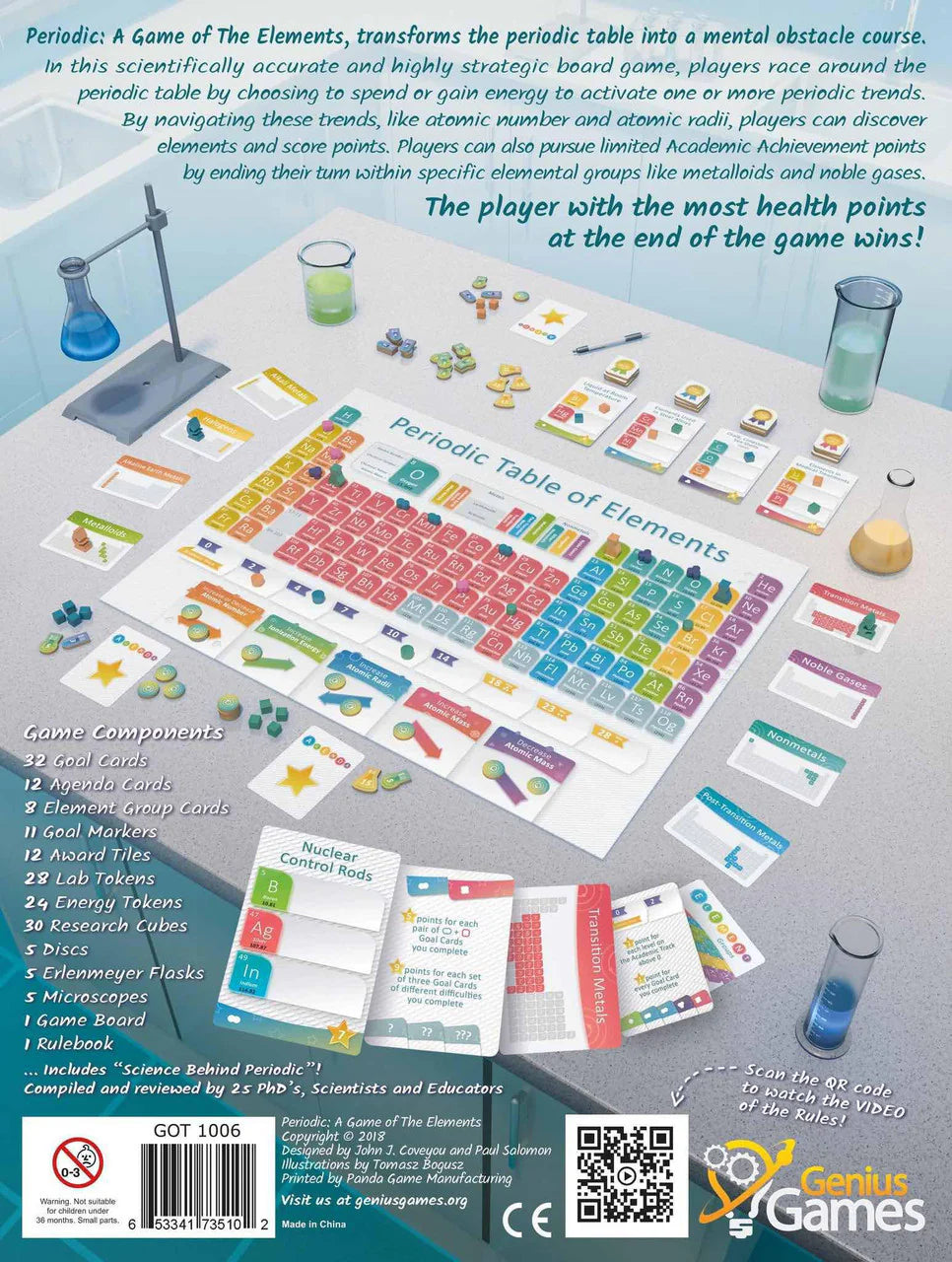 Periodic educational chemistry game with cards, tiles, tokens, and instructions displayed on a table.