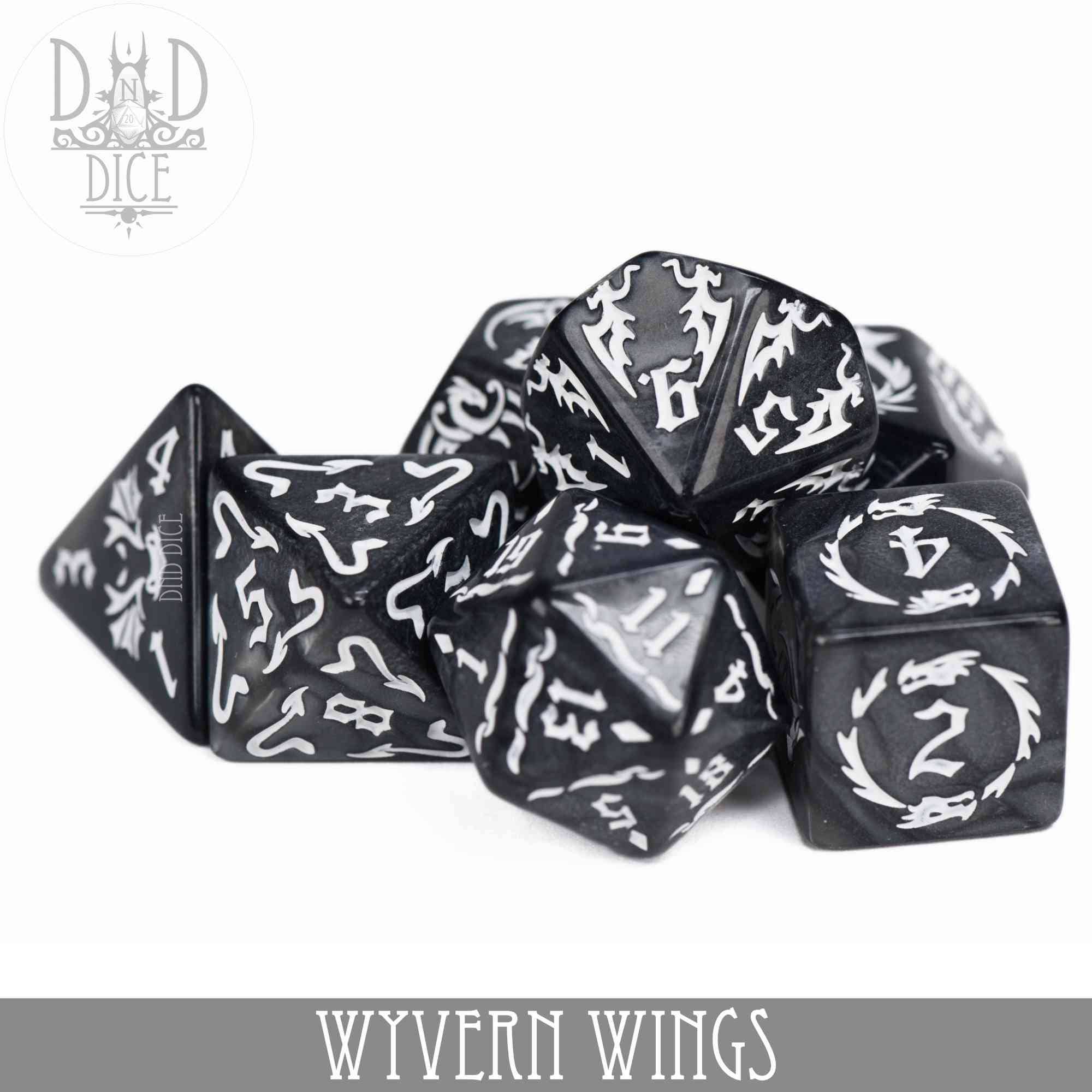 Black acrylic polyhedral dice with white numbers and wyvern designs, Wyvern Wings variant.