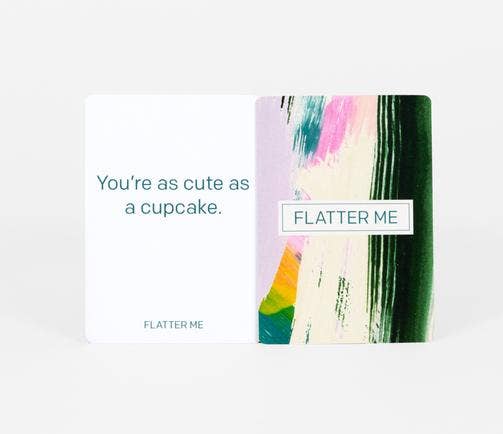 Two Flatter Me: A Compliment Battle Card Game cards; one card says You’re as cute as a cupcake.