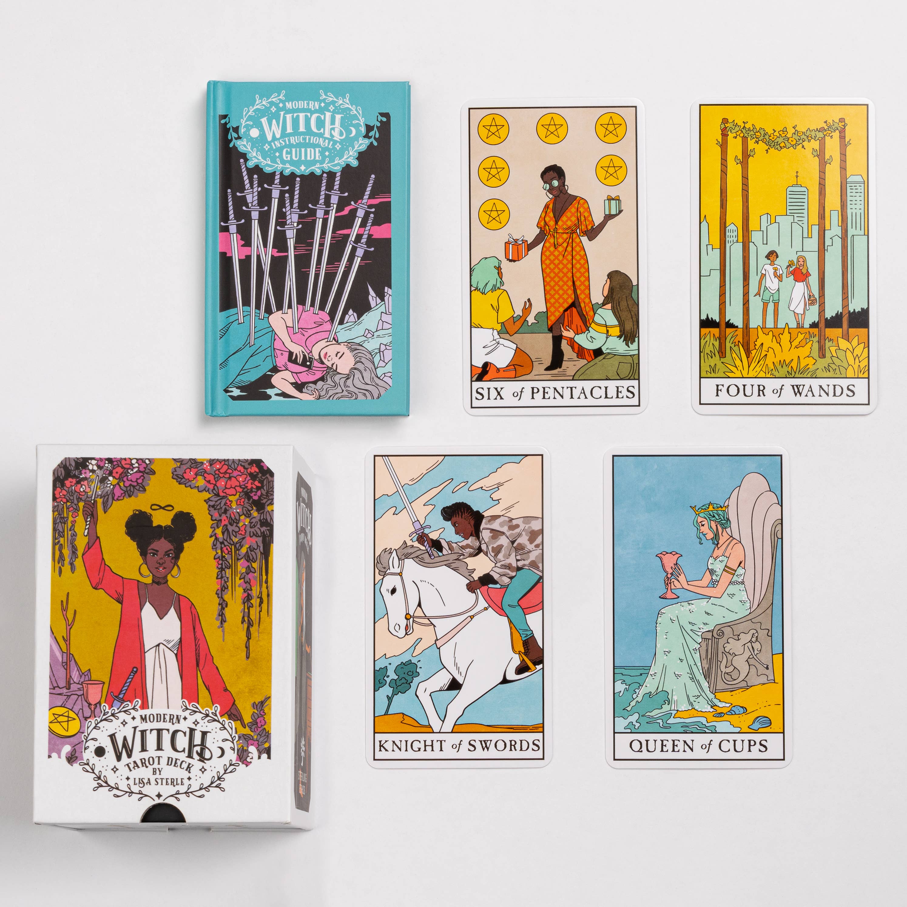 Modern Witch Tarot Deck and guidebook with four cards displayed: Six of Pentacles, Four of Wands, Knight of Swords, Queen of Cups.