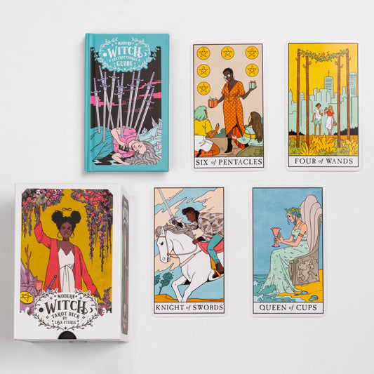 Modern Witch Tarot Deck and guidebook with four cards displayed: Six of Pentacles, Four of Wands, Knight of Swords, Queen of Cups.