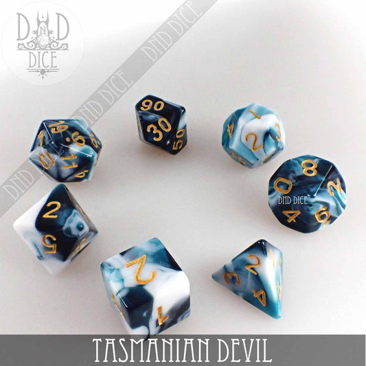 Set of blue, white, and black marbled polyhedral dice with gold numbers, Tasmanian Devil 7 or 11 variant.